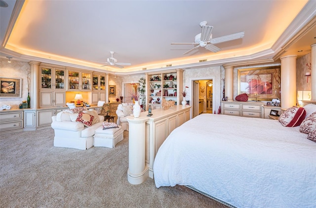 bedroom featuring a raised ceiling, carpet flooring, and crown molding