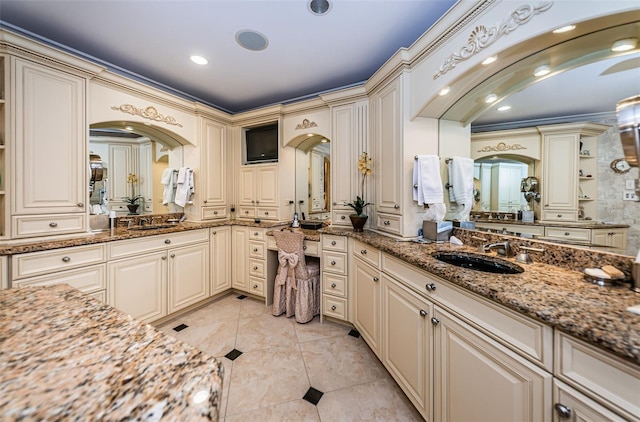 bathroom featuring two vanities, recessed lighting, and tile patterned flooring