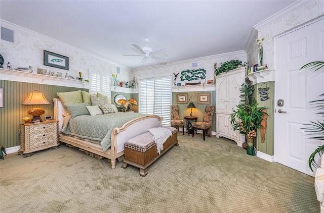bedroom with wallpapered walls, light carpet, crown molding, ceiling fan, and baseboards