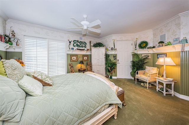 bedroom with wallpapered walls, carpet floors, crown molding, and a ceiling fan