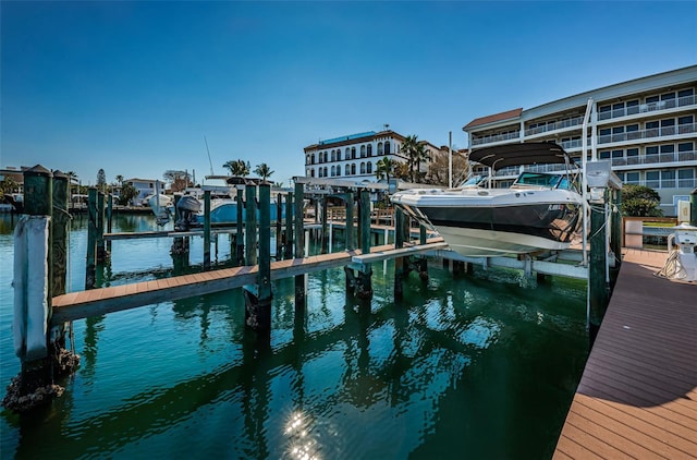 dock with boat lift and a water view
