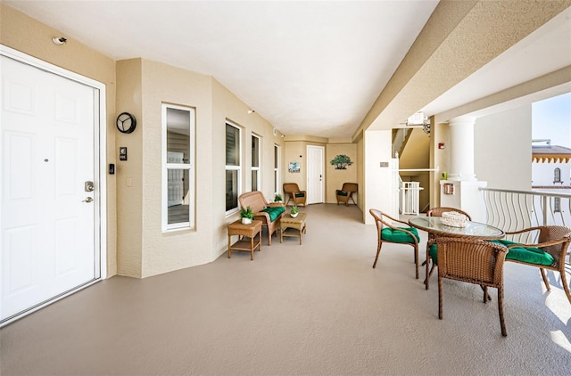 view of patio featuring a balcony