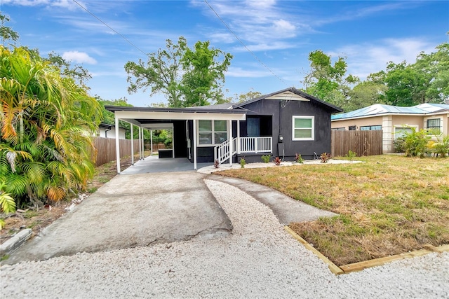 1914 E Emma St, Tampa, FL 33610 - view of front facade featuring driveway and a carport