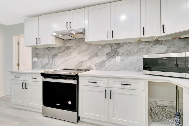 1914 E Emma St, Tampa, FL 33610 - kitchen featuring stainless steel appliances, under cabinet range hood, light countertops, and tasteful backsplash