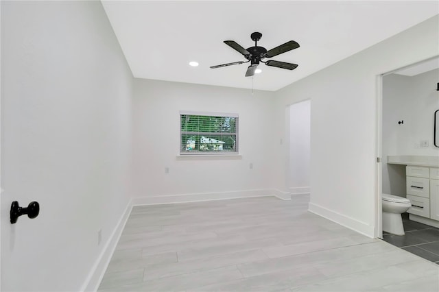 1914 E Emma St, Tampa, FL 33610 - unfurnished bedroom with baseboards, recessed lighting, connected bathroom, and ceiling fan