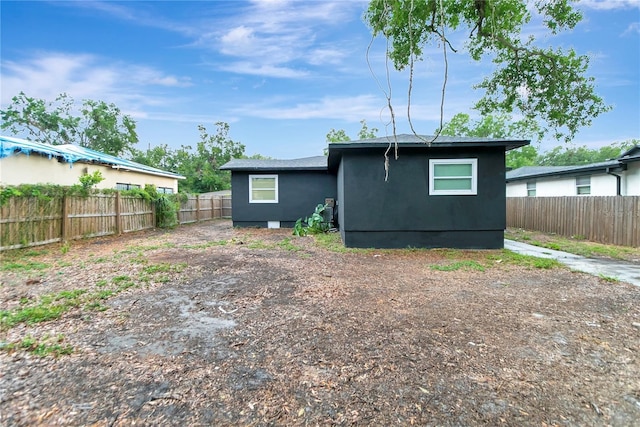 1914 E Emma St, Tampa, FL 33610 - rear view of property with a fenced backyard