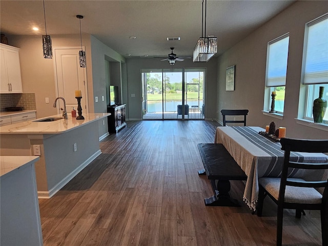 3776 Maxwell Park Dr, Sun City Center, FL 33573 - dining space with ceiling fan, dark wood-style flooring, baseboards, and recessed lighting