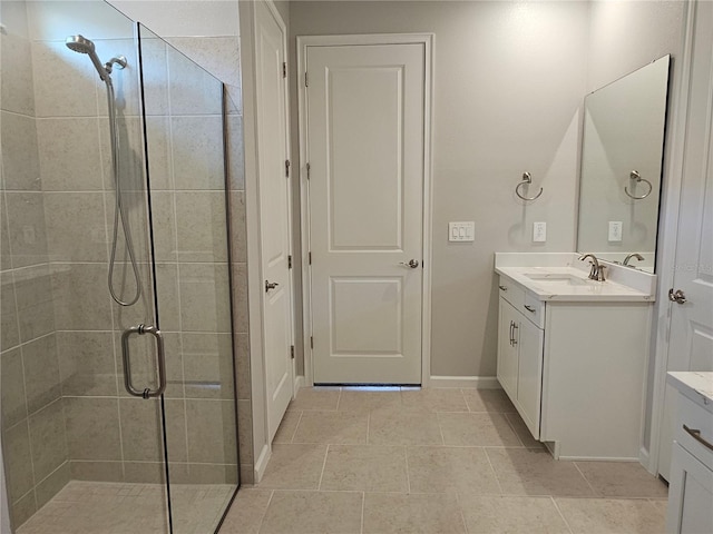 3776 Maxwell Park Dr, Sun City Center, FL 33573 - full bath featuring vanity, a stall shower, baseboards, and tile patterned floors