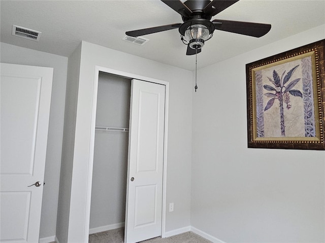 3776 Maxwell Park Dr, Sun City Center, FL 33573 - unfurnished bedroom featuring baseboards, a closet, carpet floors, and ceiling fan
