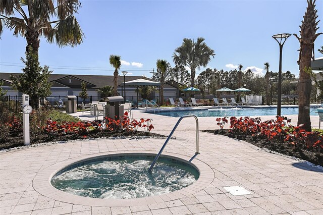 3776 Maxwell Park Dr, Sun City Center, FL 33573 - community pool with a hot tub and a patio