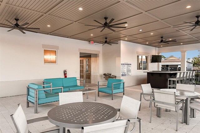 3776 Maxwell Park Dr, Sun City Center, FL 33573 - view of patio featuring outdoor dining space, a ceiling fan, and an outdoor living space