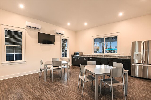 3776 Maxwell Park Dr, Sun City Center, FL 33573 - dining room featuring a wall unit AC, recessed lighting, and baseboards