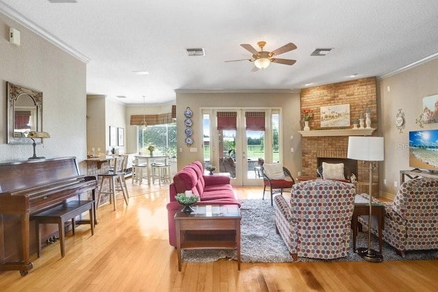 2502 Fritzke Rd, Dover, FL 33527 - living room with ornamental molding, wood finished floors, ceiling fan, and a brick fireplace