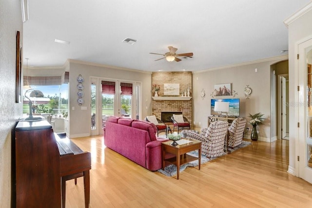 2502 Fritzke Rd, Dover, FL 33527 - living room with ceiling fan, light wood finished floors, a fireplace, baseboards, and ornamental molding