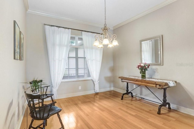 2502 Fritzke Rd, Dover, FL 33527 - dining space featuring a chandelier, wood finished floors, baseboards, and crown molding