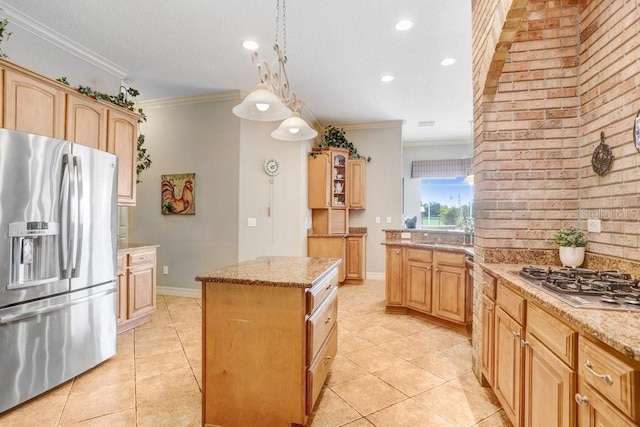 2502 Fritzke Rd, Dover, FL 33527 - kitchen featuring stainless steel appliances, ornamental molding, light stone counters, light tile patterned floors, and a kitchen island