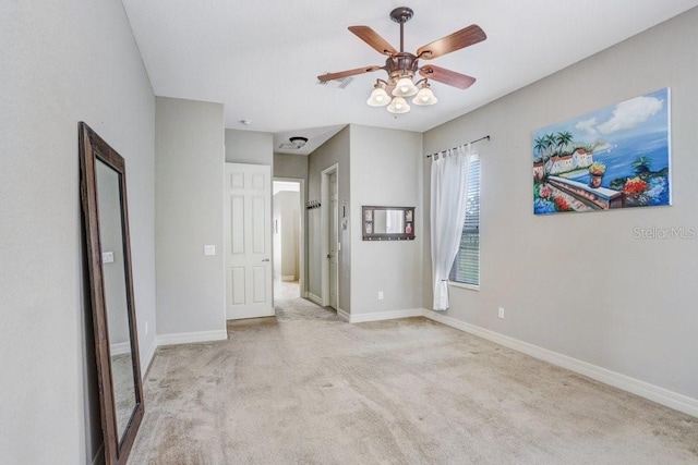 2502 Fritzke Rd, Dover, FL 33527 - unfurnished bedroom featuring light colored carpet, baseboards, and a ceiling fan