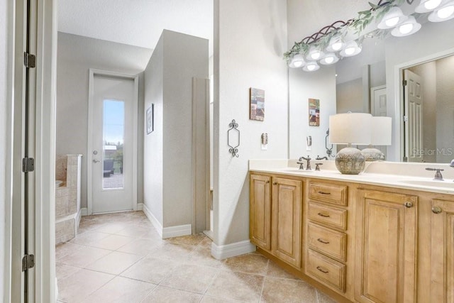 2502 Fritzke Rd, Dover, FL 33527 - full bath featuring double vanity, tile patterned floors, and baseboards