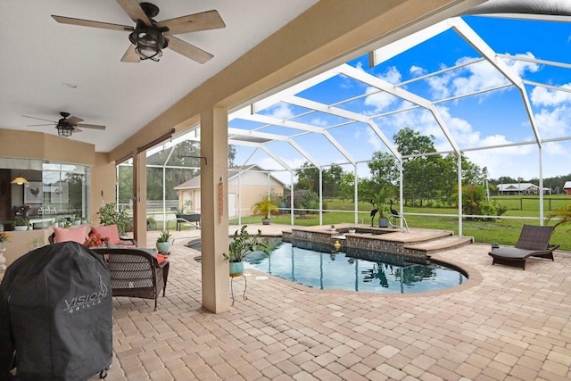 2502 Fritzke Rd, Dover, FL 33527 - view of swimming pool with ceiling fan, a patio area, a pool with connected hot tub, and a lanai