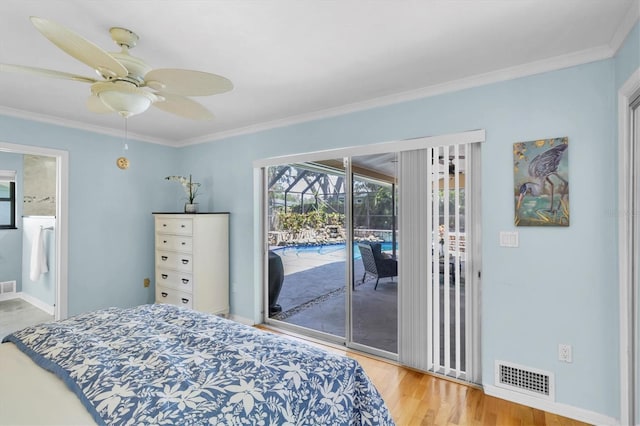 2287 Demaret Dr, Dunedin, FL 34698 - bedroom with access to outside, ornamental molding, wood finished floors, ensuite bathroom, and ceiling fan