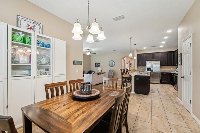 9917 Prevatt St, Gibsonton, FL 33534 - dining space featuring a chandelier, ceiling fan, recessed lighting, and light tile patterned floors