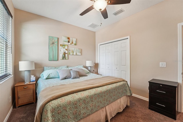 9917 Prevatt St, Gibsonton, FL 33534 - bedroom featuring dark carpet, a closet, baseboards, and a ceiling fan