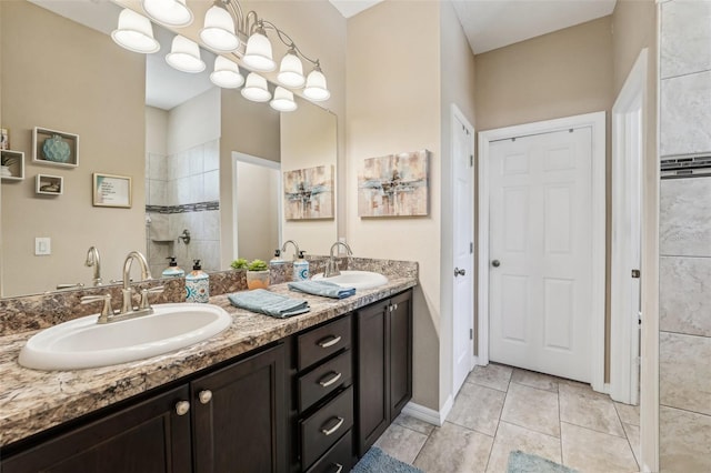 9917 Prevatt St, Gibsonton, FL 33534 - bathroom featuring walk in shower, double vanity, and tile patterned floors