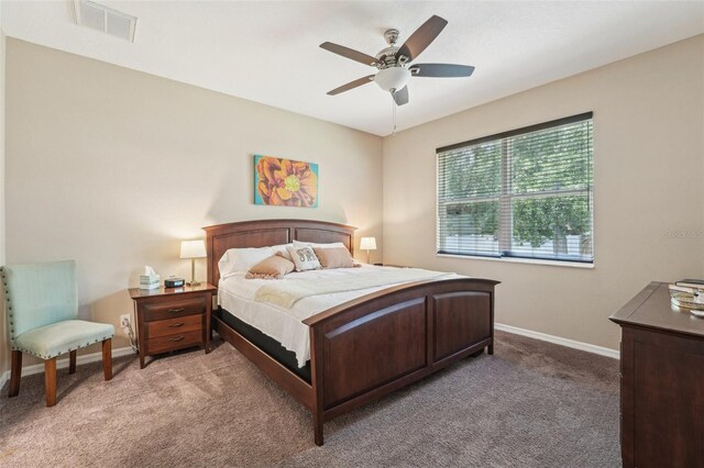 9917 Prevatt St, Gibsonton, FL 33534 - bedroom featuring light colored carpet, baseboards, and a ceiling fan