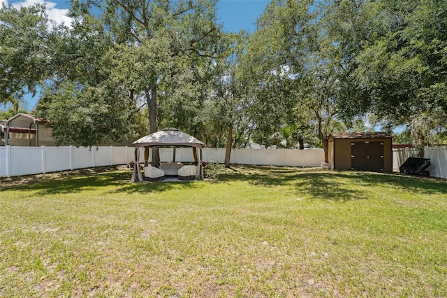 9917 Prevatt St, Gibsonton, FL 33534 - view of yard with a gazebo, a storage unit, and an outbuilding