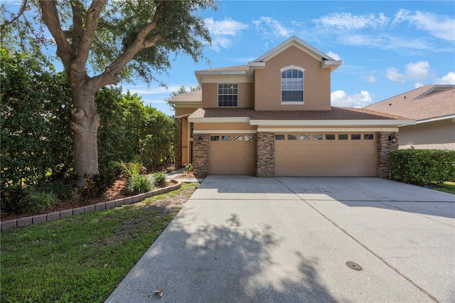 17809 Sandpine Trace Way, Tampa, FL 33647 - traditional home featuring stone siding, driveway, stucco siding, and an attached garage