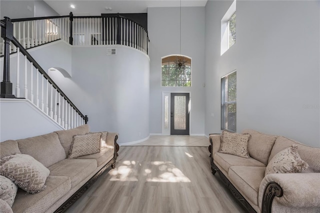 17809 Sandpine Trace Way, Tampa, FL 33647 - living area with a high ceiling, wood finished floors, and baseboards