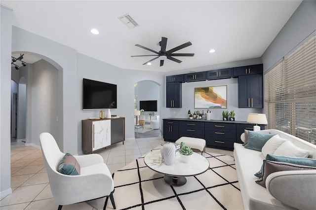 17809 Sandpine Trace Way, Tampa, FL 33647 - living area featuring arched walkways, a ceiling fan, recessed lighting, light tile patterned floors, and healthy amount of natural light