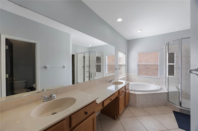 17809 Sandpine Trace Way, Tampa, FL 33647 - bathroom with tile patterned floors, a shower stall, toilet, a bath, and double vanity