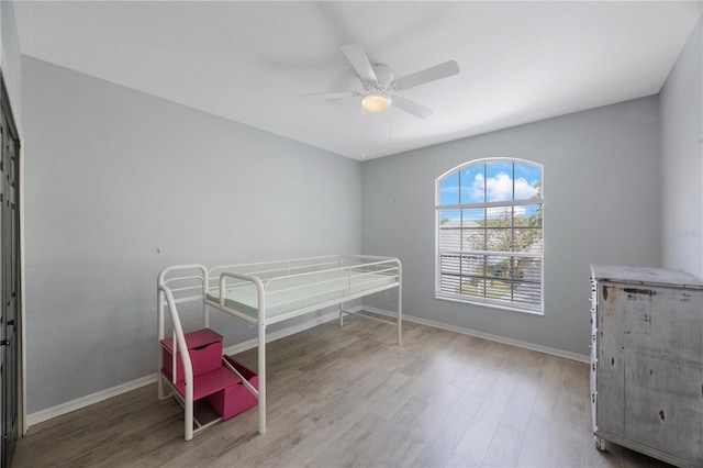 17809 Sandpine Trace Way, Tampa, FL 33647 - bedroom featuring wood finished floors, baseboards, and a ceiling fan