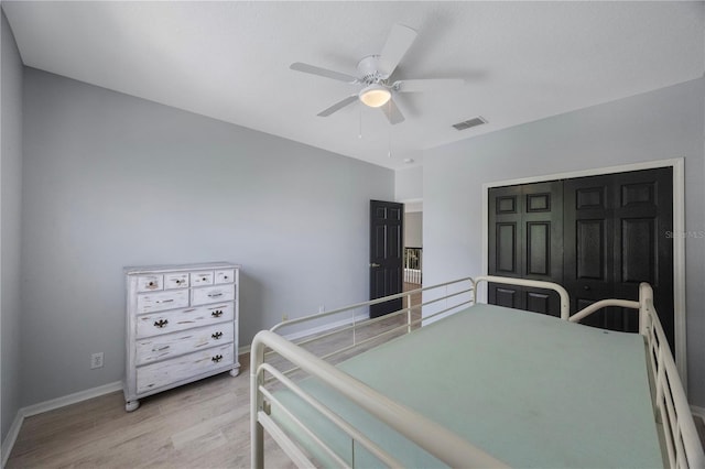 17809 Sandpine Trace Way, Tampa, FL 33647 - bedroom with light wood-type flooring, baseboards, ceiling fan, and a baseboard radiator