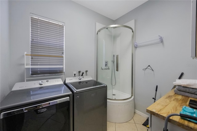 17809 Sandpine Trace Way, Tampa, FL 33647 - washroom featuring washer and dryer, light tile patterned floors, and baseboards