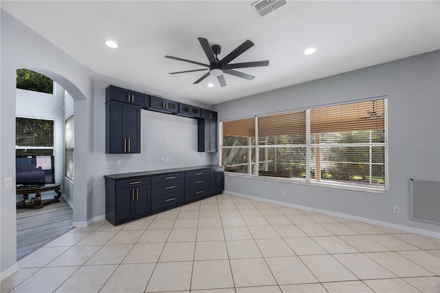 17809 Sandpine Trace Way, Tampa, FL 33647 - kitchen with ceiling fan, arched walkways, baseboards, dark countertops, and recessed lighting