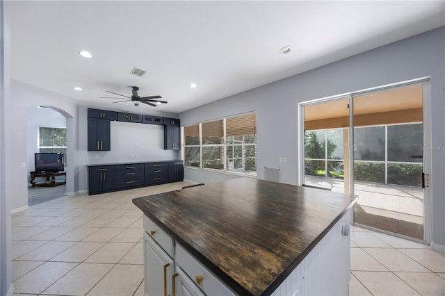 17809 Sandpine Trace Way, Tampa, FL 33647 - kitchen featuring light tile patterned floors, arched walkways, ceiling fan, plenty of natural light, and recessed lighting