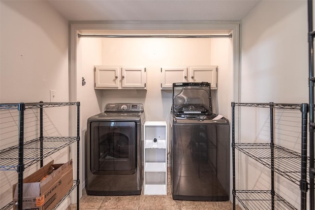 laundry area featuring cabinet space and washer and dryer
