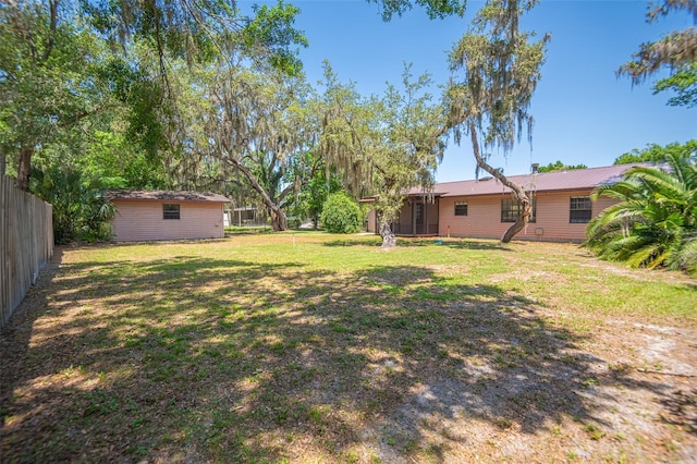 view of yard featuring a sunroom