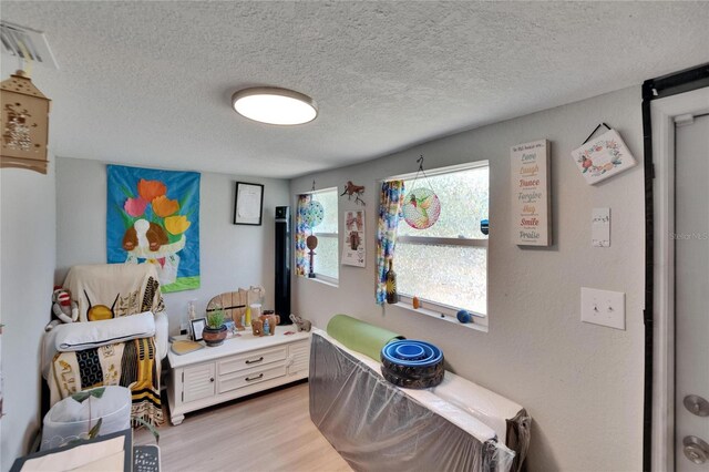 528 S Seminole Ave, Fort Meade, FL 33841 - bedroom featuring light wood-style floors and a textured ceiling