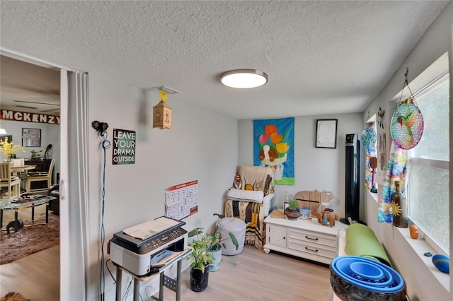 528 S Seminole Ave, Fort Meade, FL 33841 - game room featuring wood finished floors and a textured ceiling