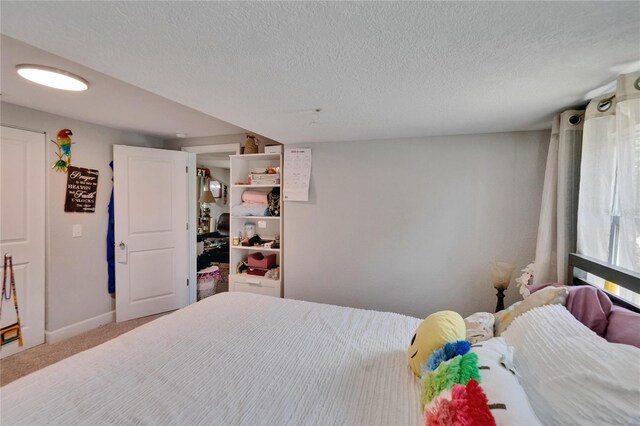 528 S Seminole Ave, Fort Meade, FL 33841 - bedroom featuring a textured ceiling, carpet, and baseboards