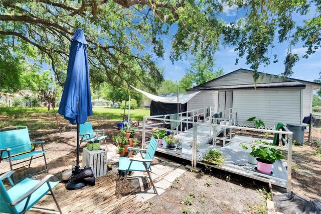 528 S Seminole Ave, Fort Meade, FL 33841 - rear view of house with a wooden deck