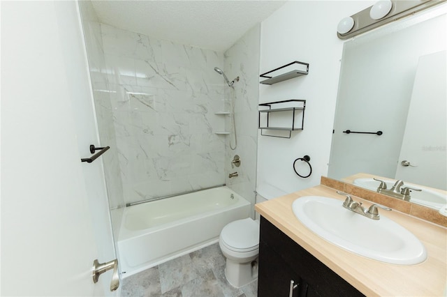 bathroom with toilet, vanity, and tub / shower combination