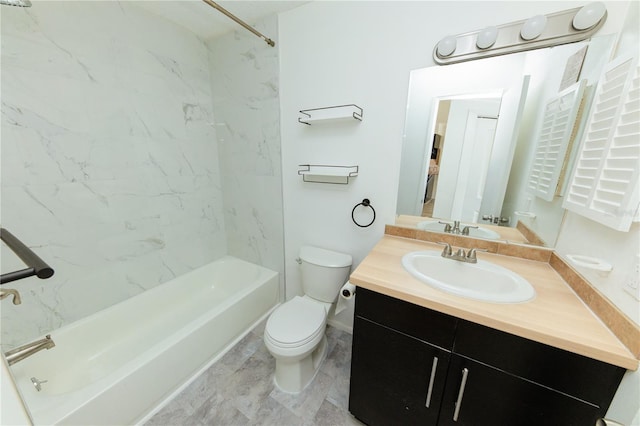 bathroom featuring toilet, vanity, and bathing tub / shower combination