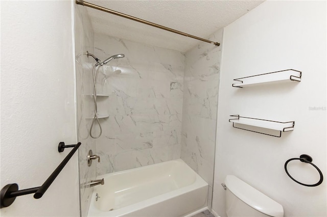 bathroom featuring toilet, shower / washtub combination, and a textured ceiling