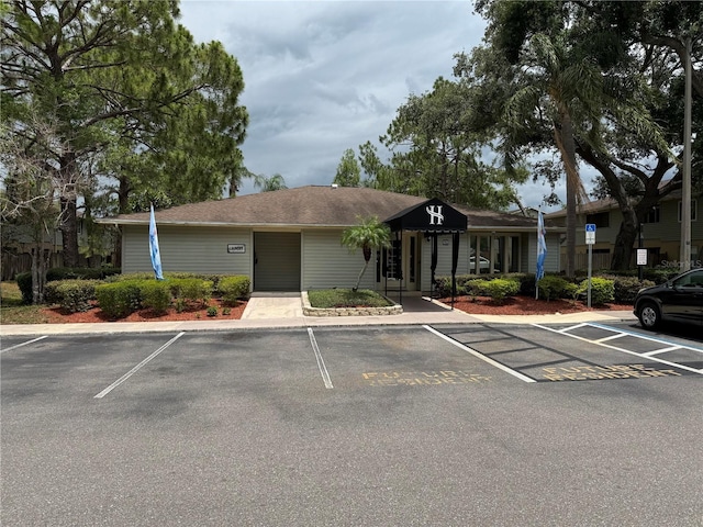 view of property with uncovered parking