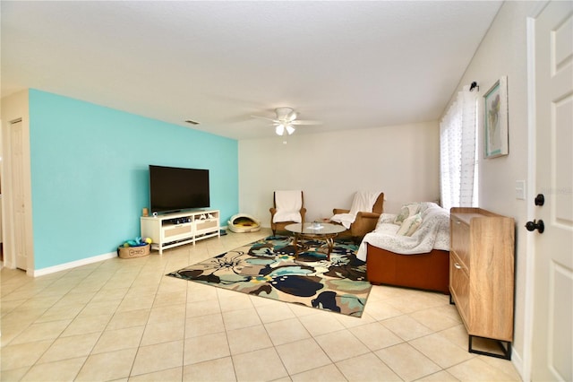6150 Gulfport Blvd S Unit 302, Gulfport, FL 33707 - tiled living area with ceiling fan and baseboards