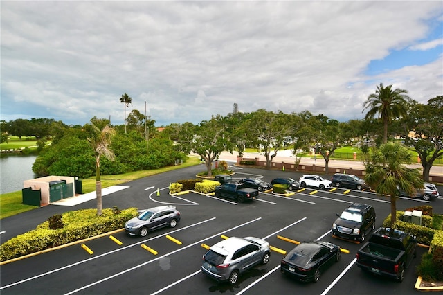 6150 Gulfport Blvd S Unit 302, Gulfport, FL 33707 - uncovered parking lot with view of wooded area
